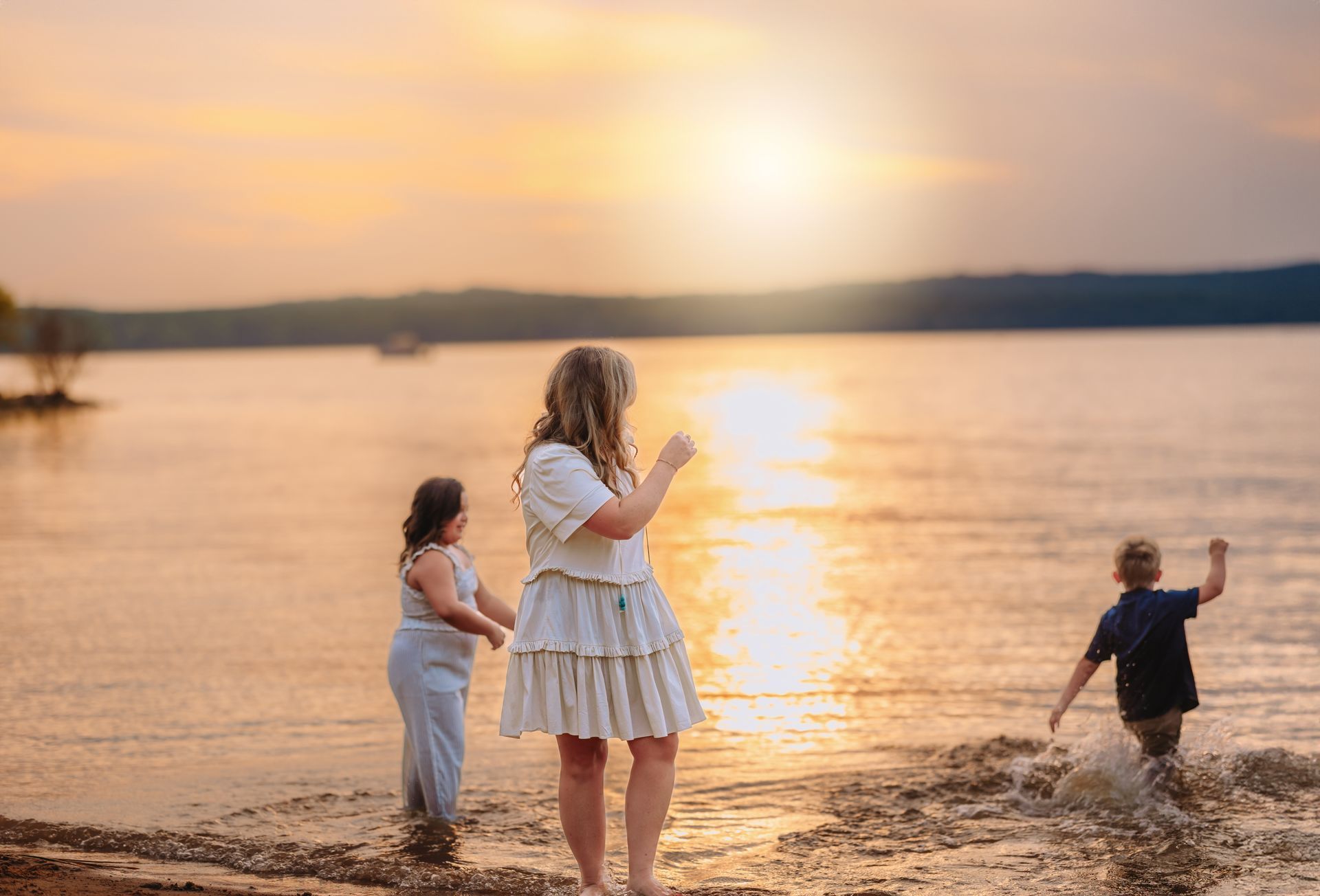 Mother and children playing during the summer time at jordan lake NC