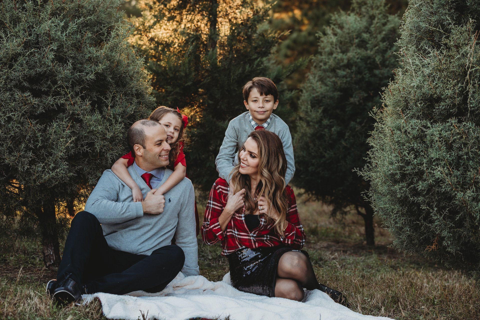 Capture magical holiday moments with family and friends among beautiful evergreen trees and festive decorations Raleigh Christmas Tree Farm Mini Sessions at Jordan Lake Christmas Tree Farm