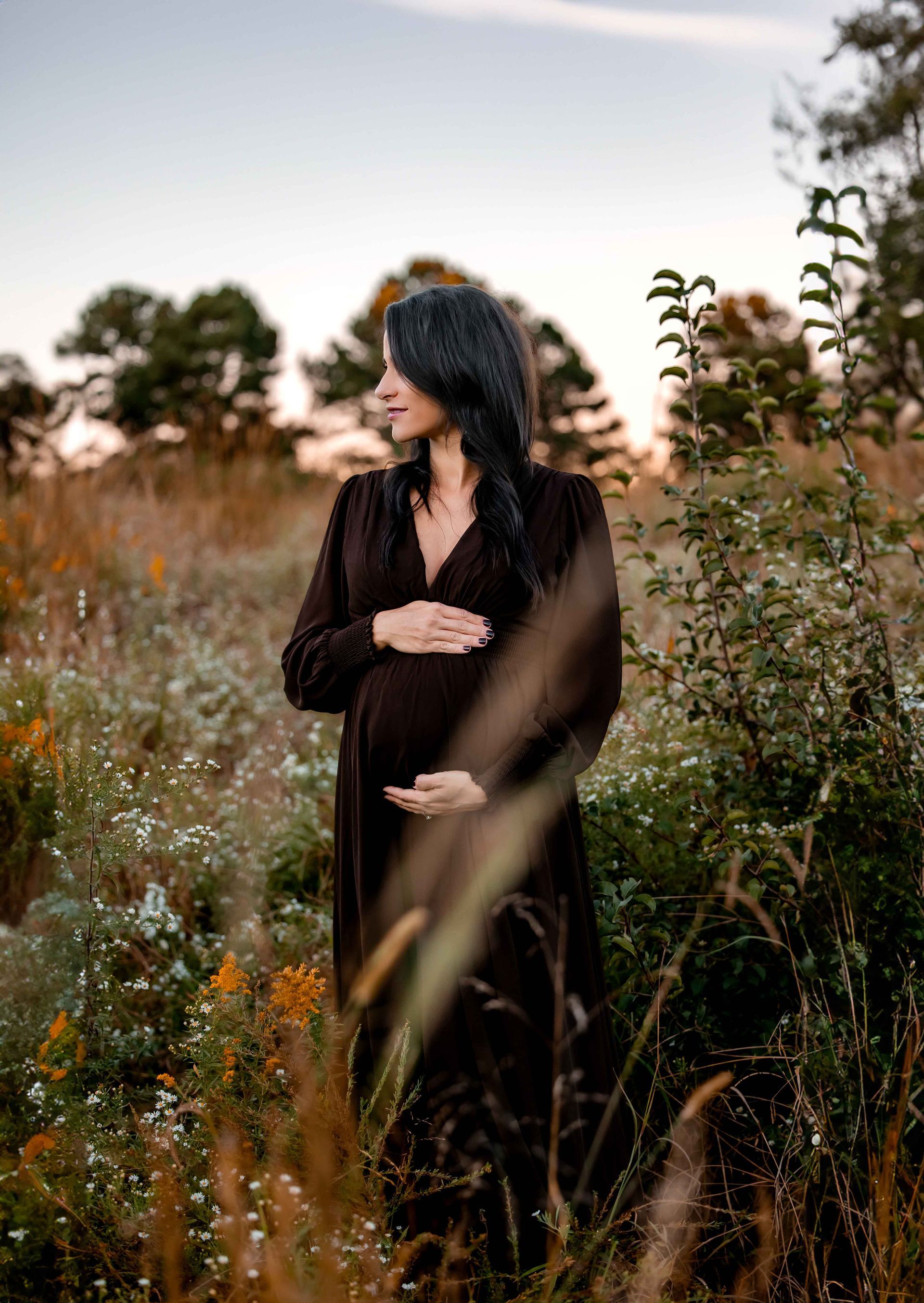 Maternity portrait session during fall golden hour at NCMA in Raleigh, North Carolina
