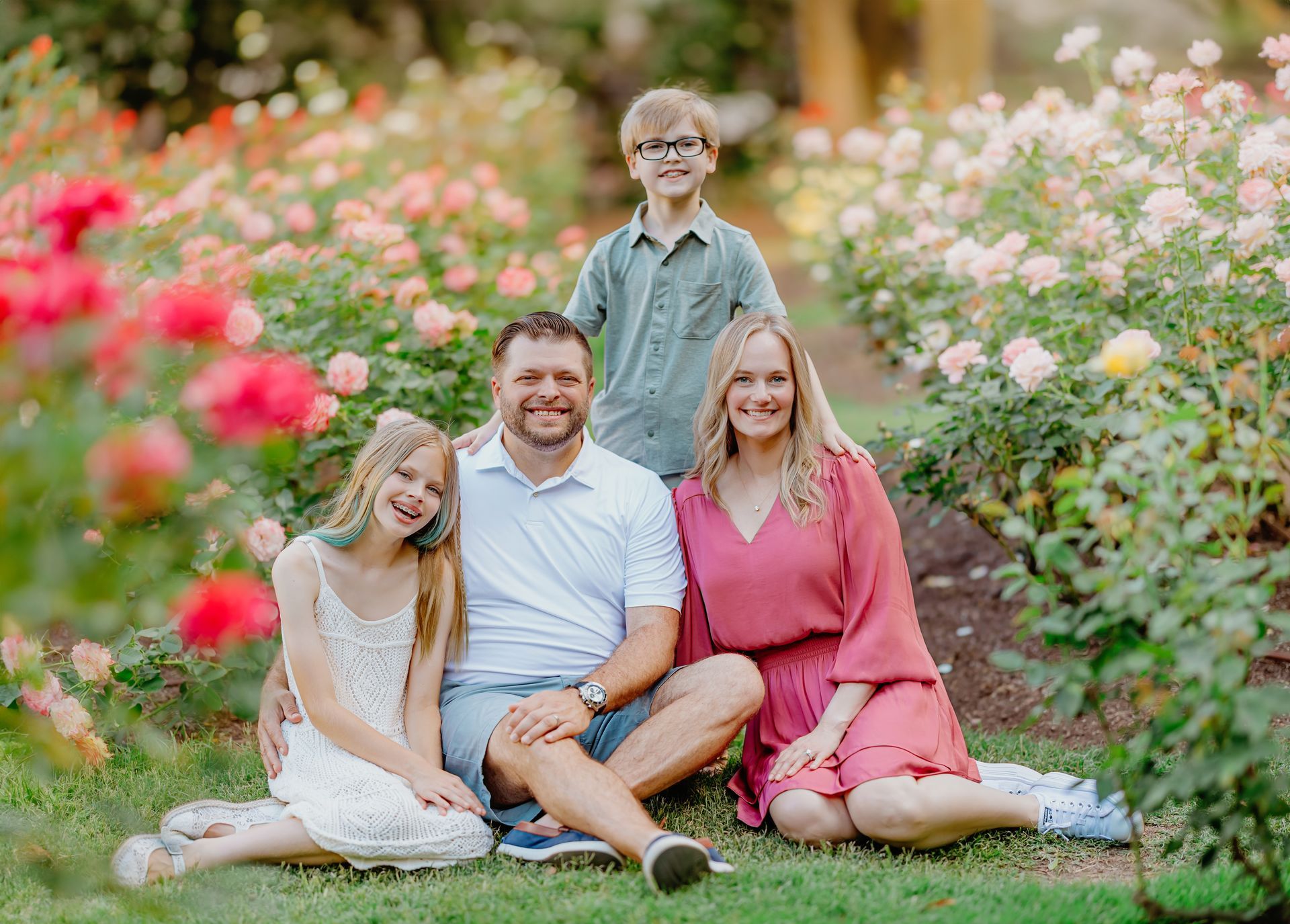 Mother’s Day portrait session in a vibrant red poppy field with natural light