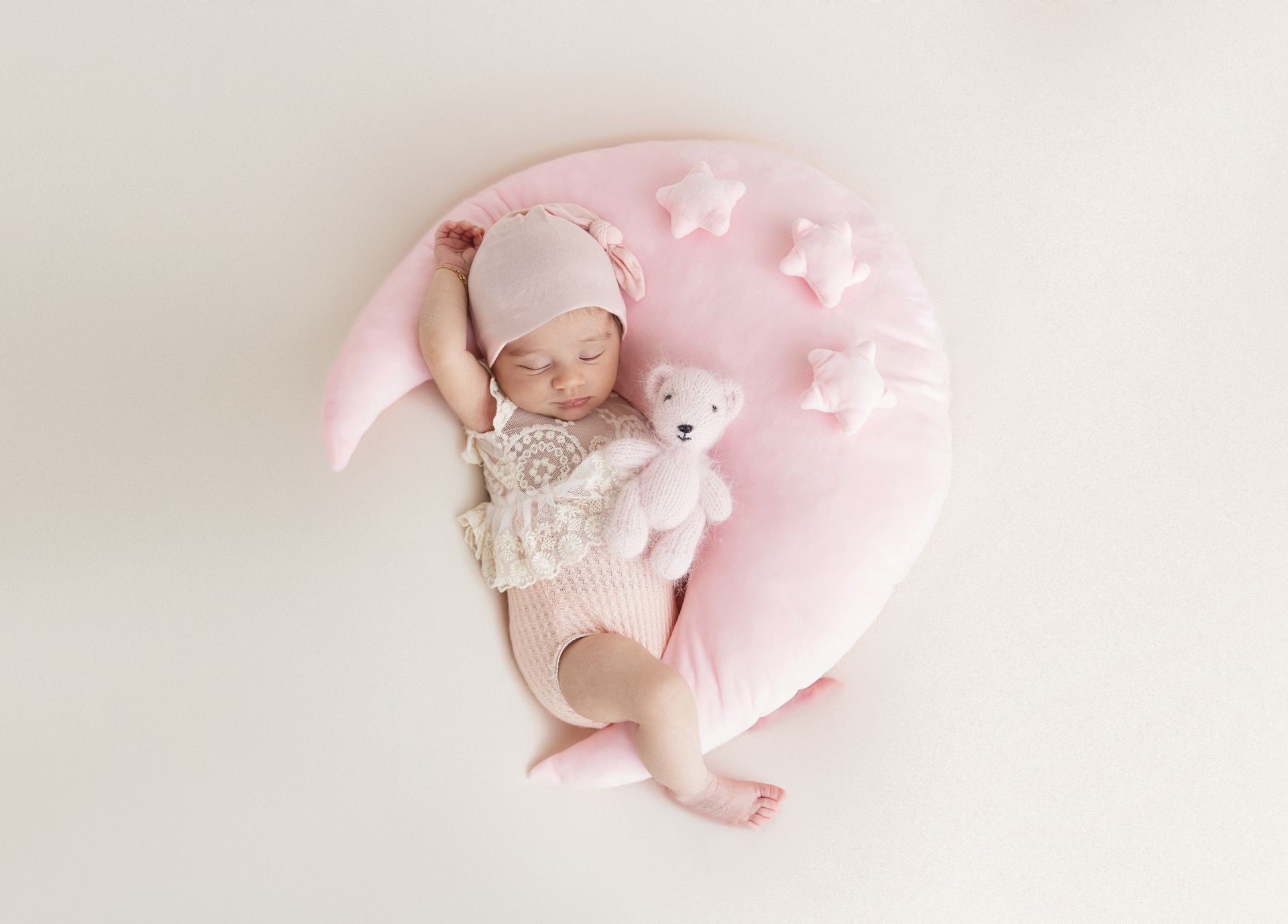 High-resolution newborn girl photo in cozy Cary
photography studio