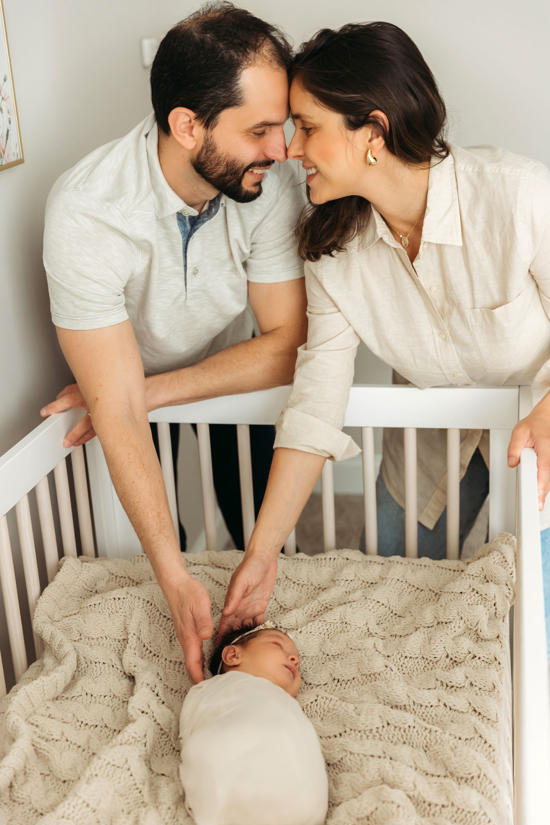 parents and newborn posing for the newborn in-home session portraits in Cary NC Luciana Galucci Photography
