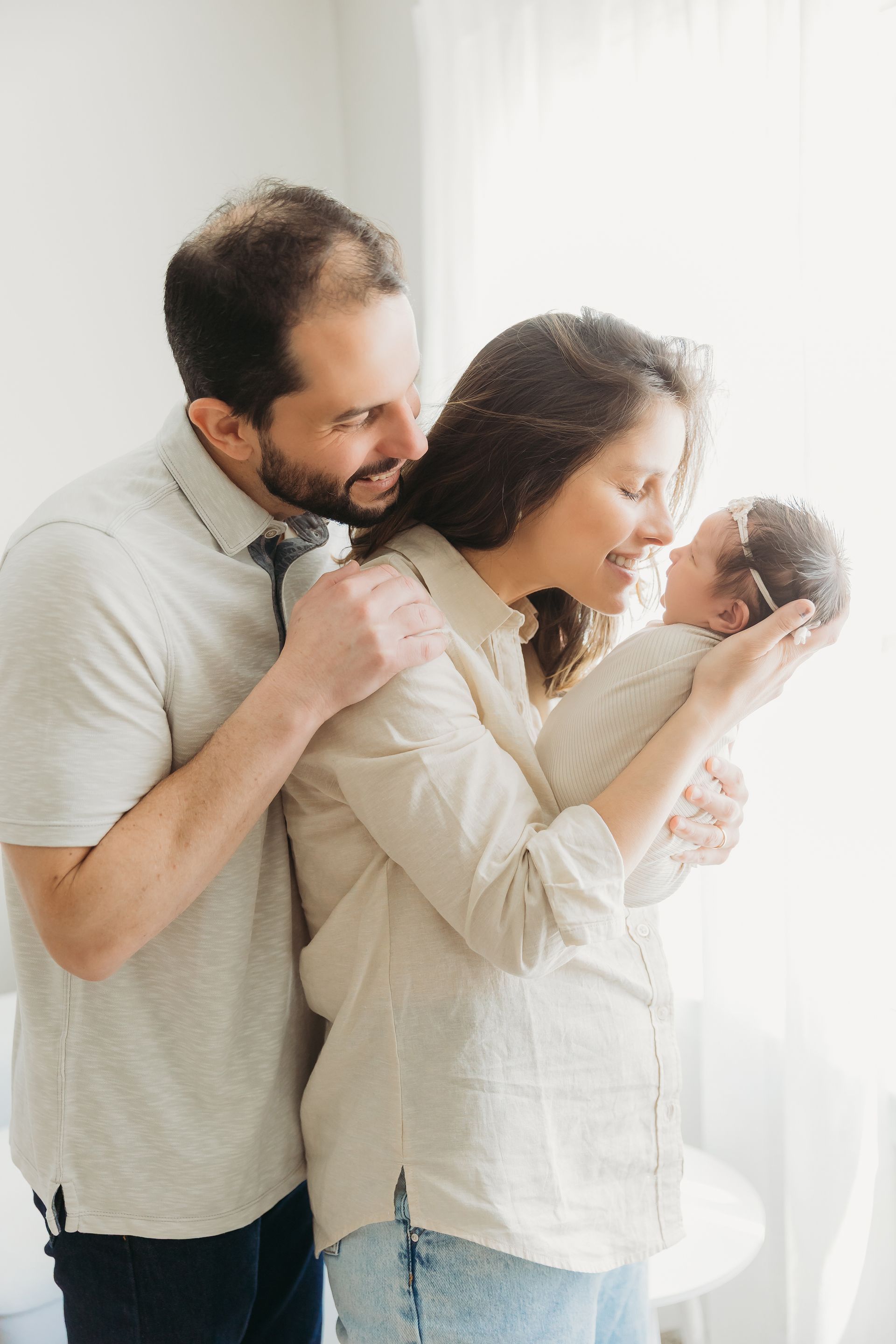 parents and baby in home newborn portraits