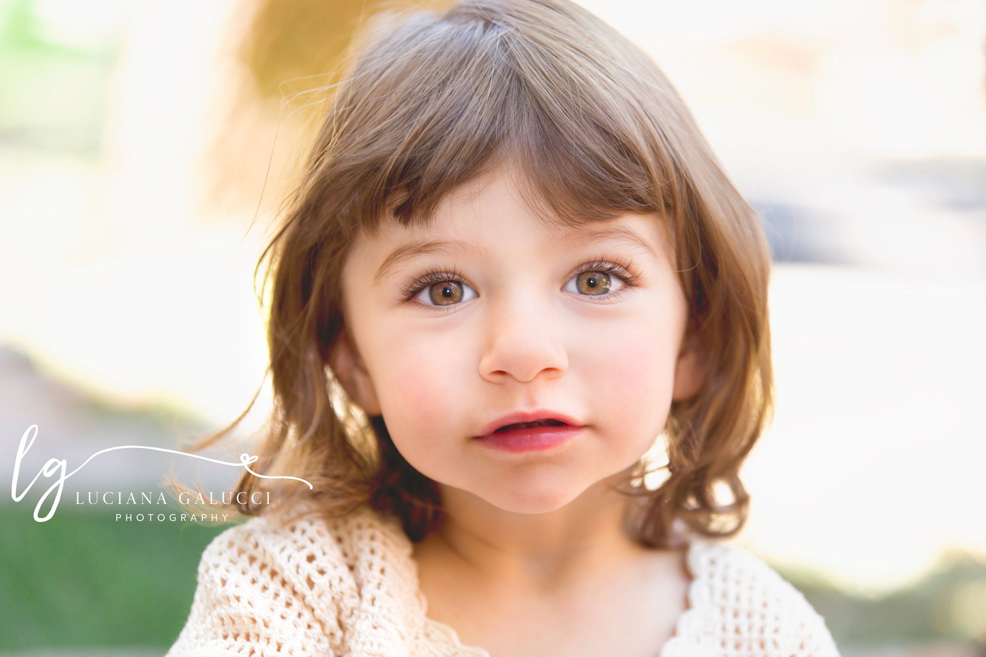 Toddler girl portrait smiling and looking at the camera