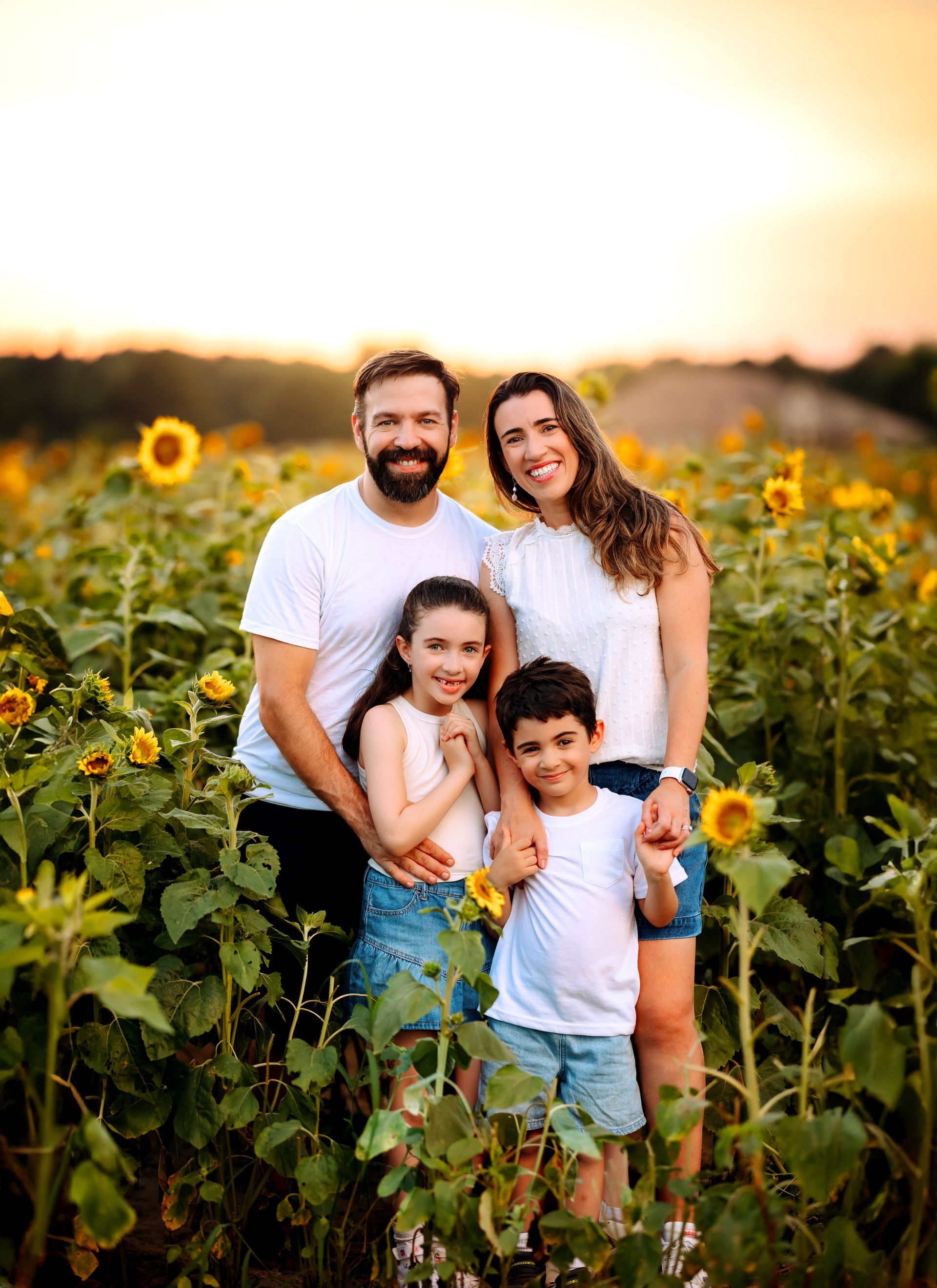 happy couples at the Sunflowers field in Raleigh during the summer Family Photoshoot