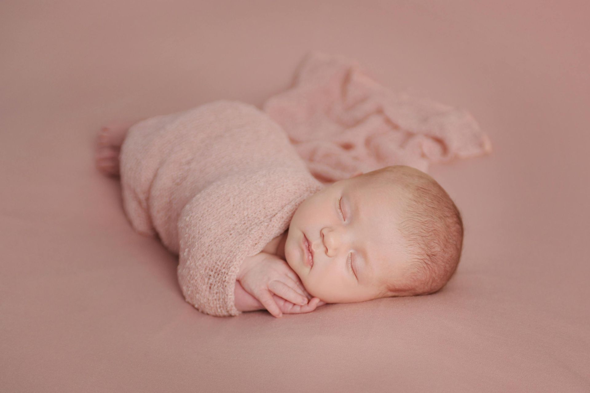 newborn girl bean bag posed