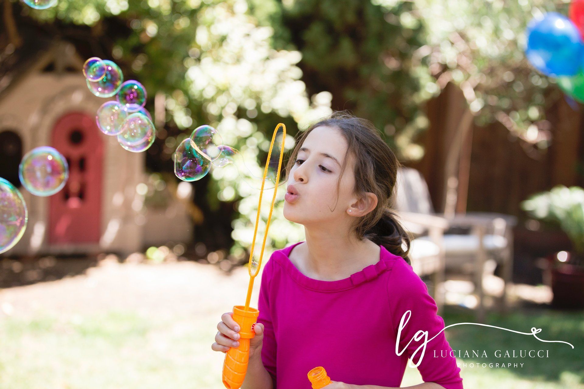Girl blowing bubbles in Raleigh NC