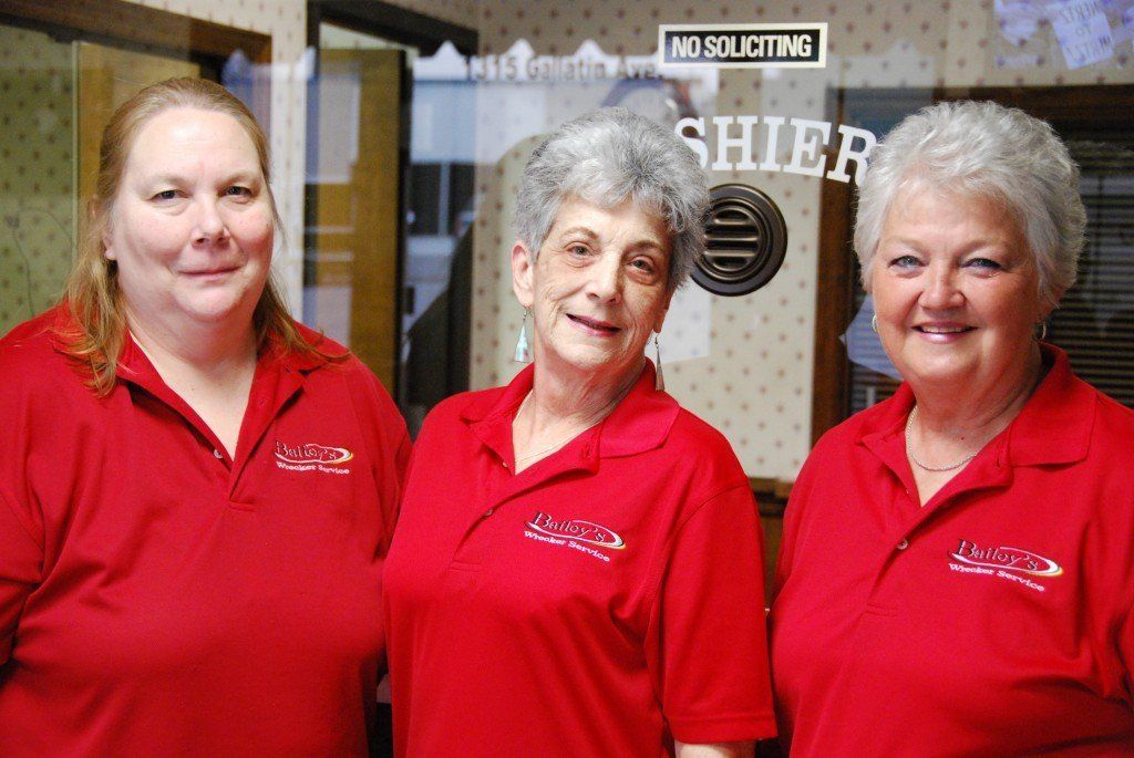 Staffs In Red Uniform — Nashville, TN — Martin’s Wrecker Service Staffs In Red Uniform — Nashville, TN — Martin’s Wrecker Service