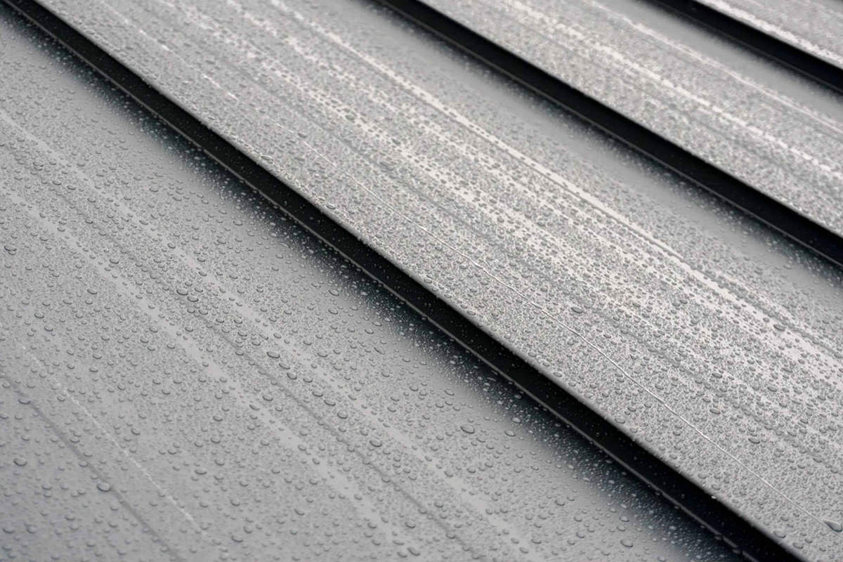 Interlock standing seam metal roofing system with modern aluminum panels installed in British Columbia