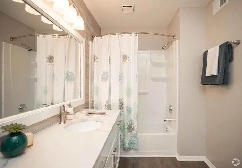Full bathroom with tub and shower at 2100 Defoors apartments in West Midtown Atlanta