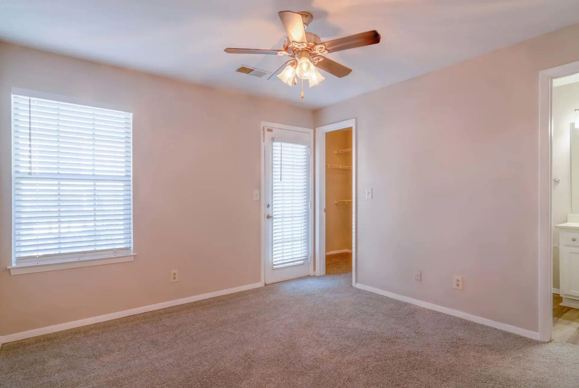 Bedroom with ceiling fan and natural light at 2100 Defoors apartments in West Midtown Atlanta