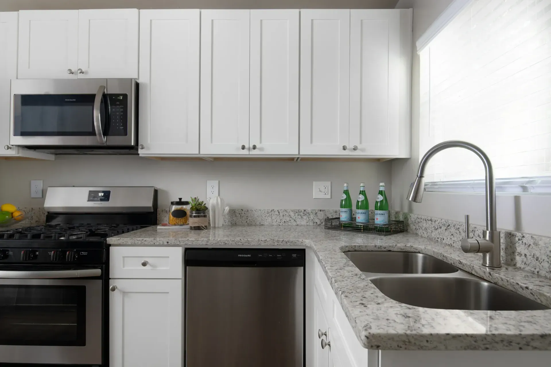 Kitchen with stainless appliances at Collier Flats apartments
