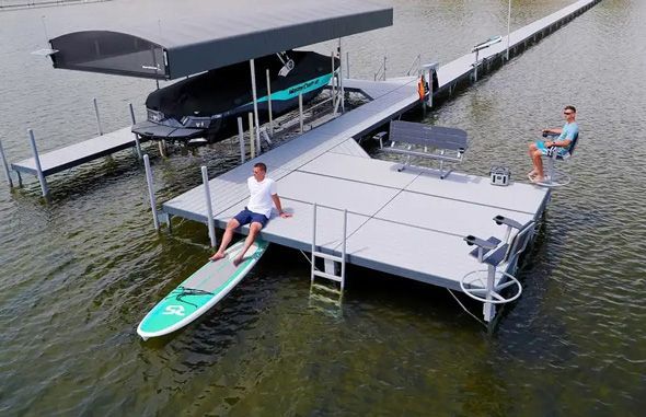 Aluminum pipe dock featuring a swivel chair, dock bench, and ladder.