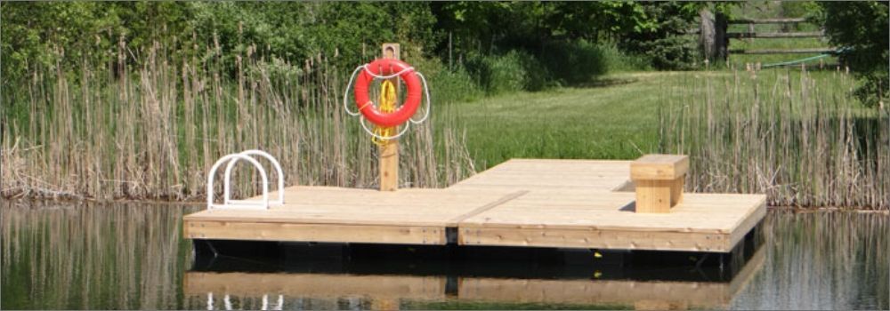 An image of a beautiful customized wood floating dock with a built in bench