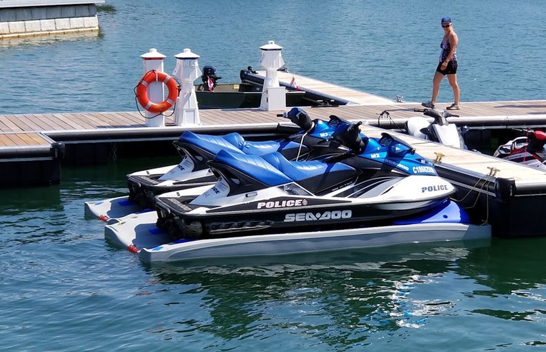 Docks Unlimited - DockinaBox - DockinaPort Ride-On System An image of jet skis parked on DockinaPort Ride-On Systems