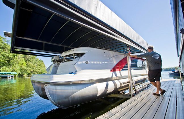Docks Unlimted - Shorestation - Pontoon Lift An image of a Pontoon Lift under a canopy