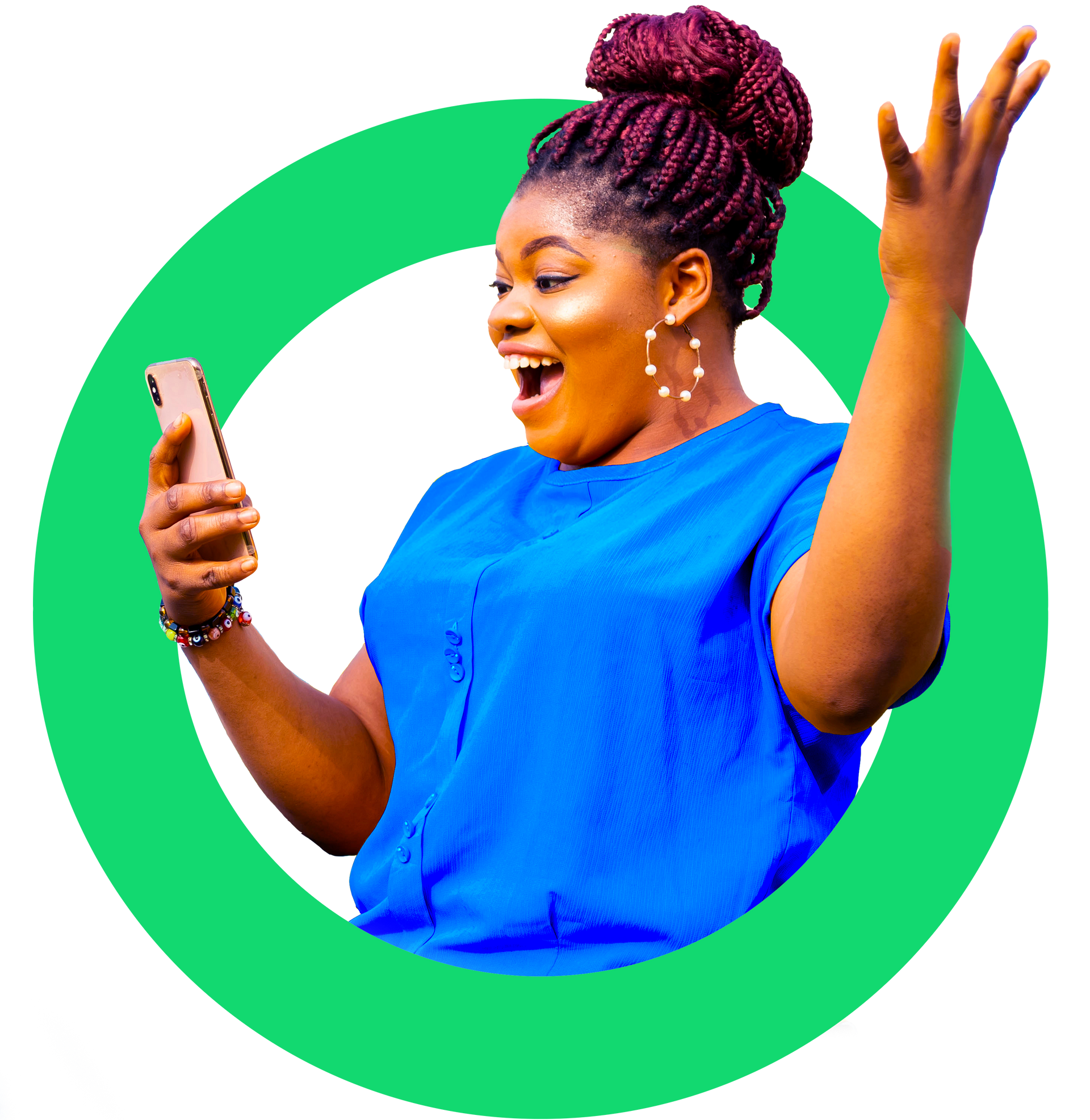 A woman in a blue shirt is holding a cell phone in her hand.