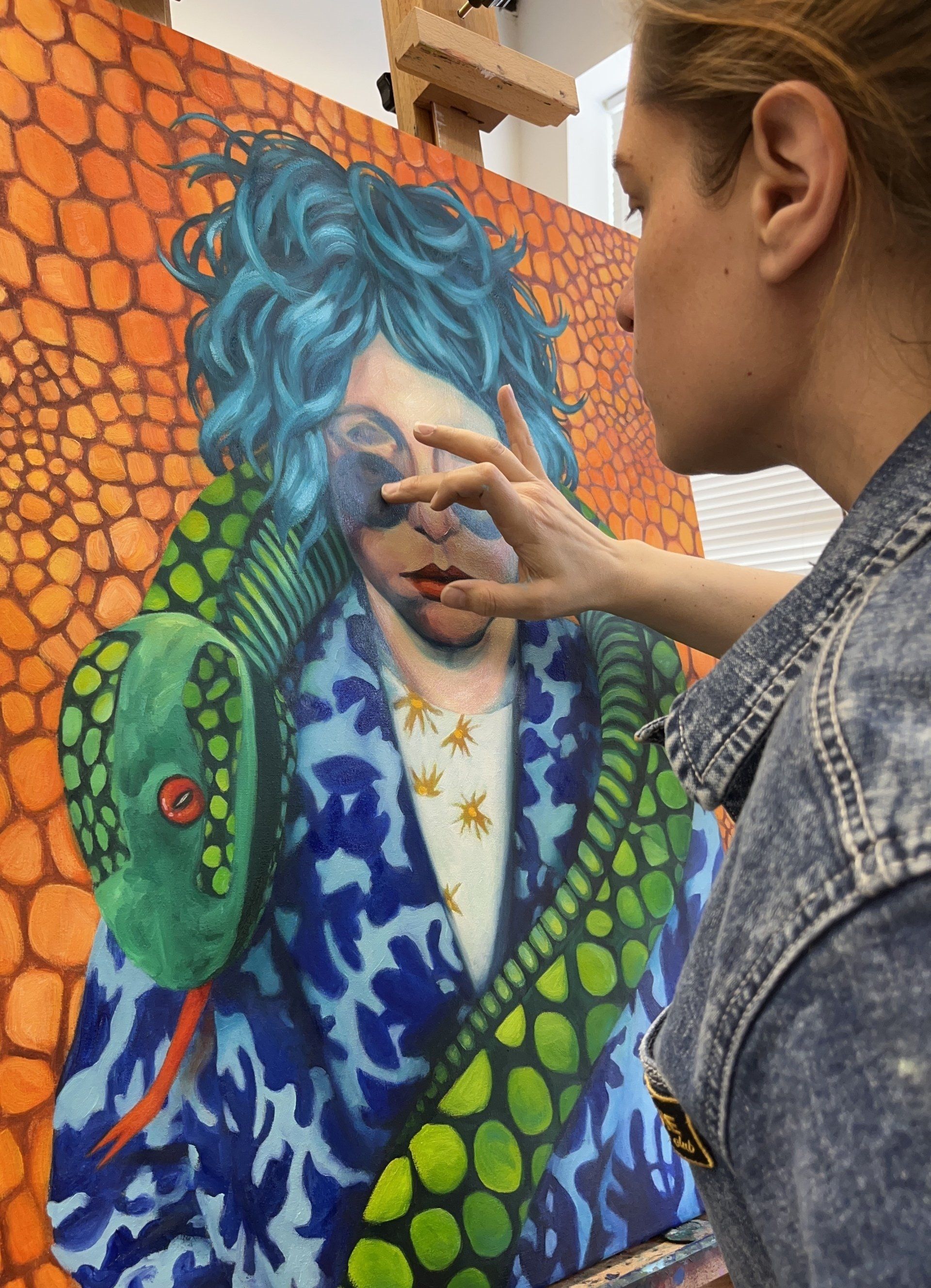 the artist working on a painting