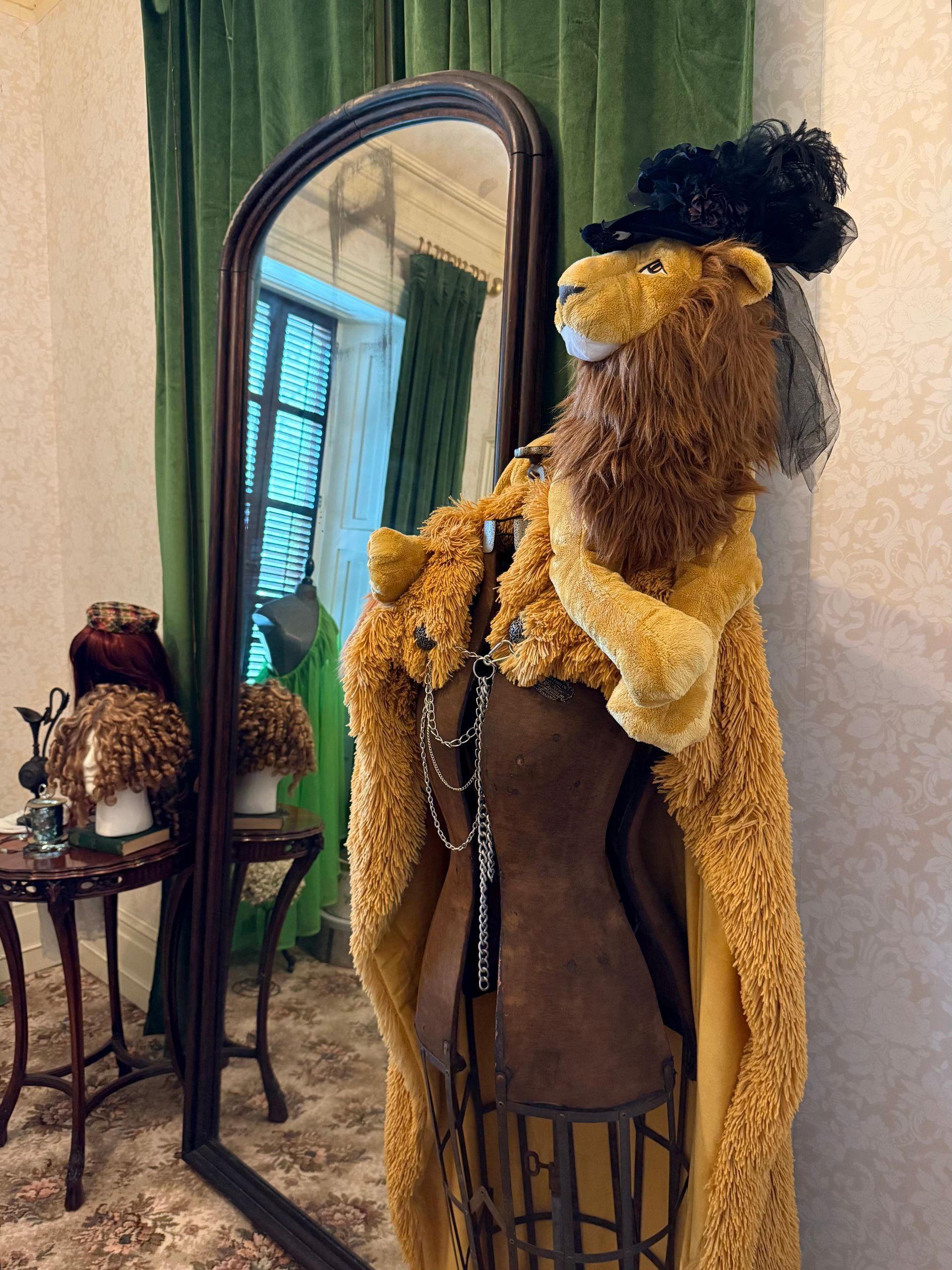 installation with lion cape and mirror at Rockwood Museum