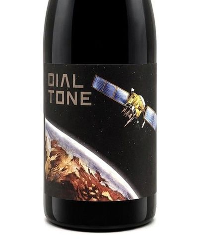 Wine bottle label with “Dial Tone” showing a satellite above a planet's surface