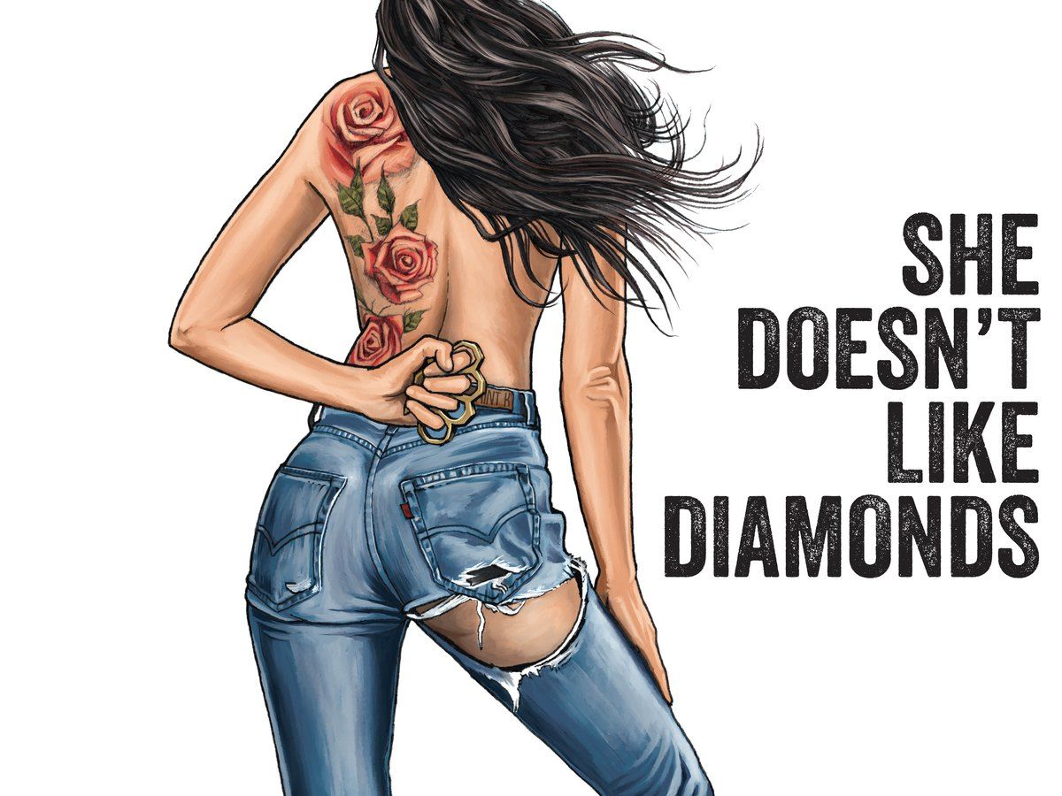 Woman in jeans with floral back tattoo and slogan “She doesn’t like diamonds” beside her.