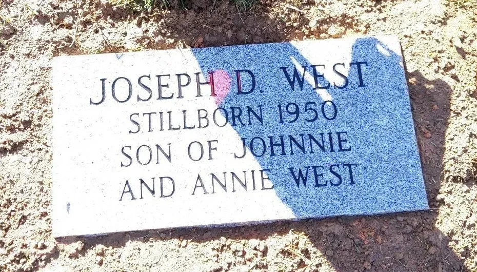 Gravestone for Joseph D. West, stillborn 1950, son of Johnnie and Annie West.