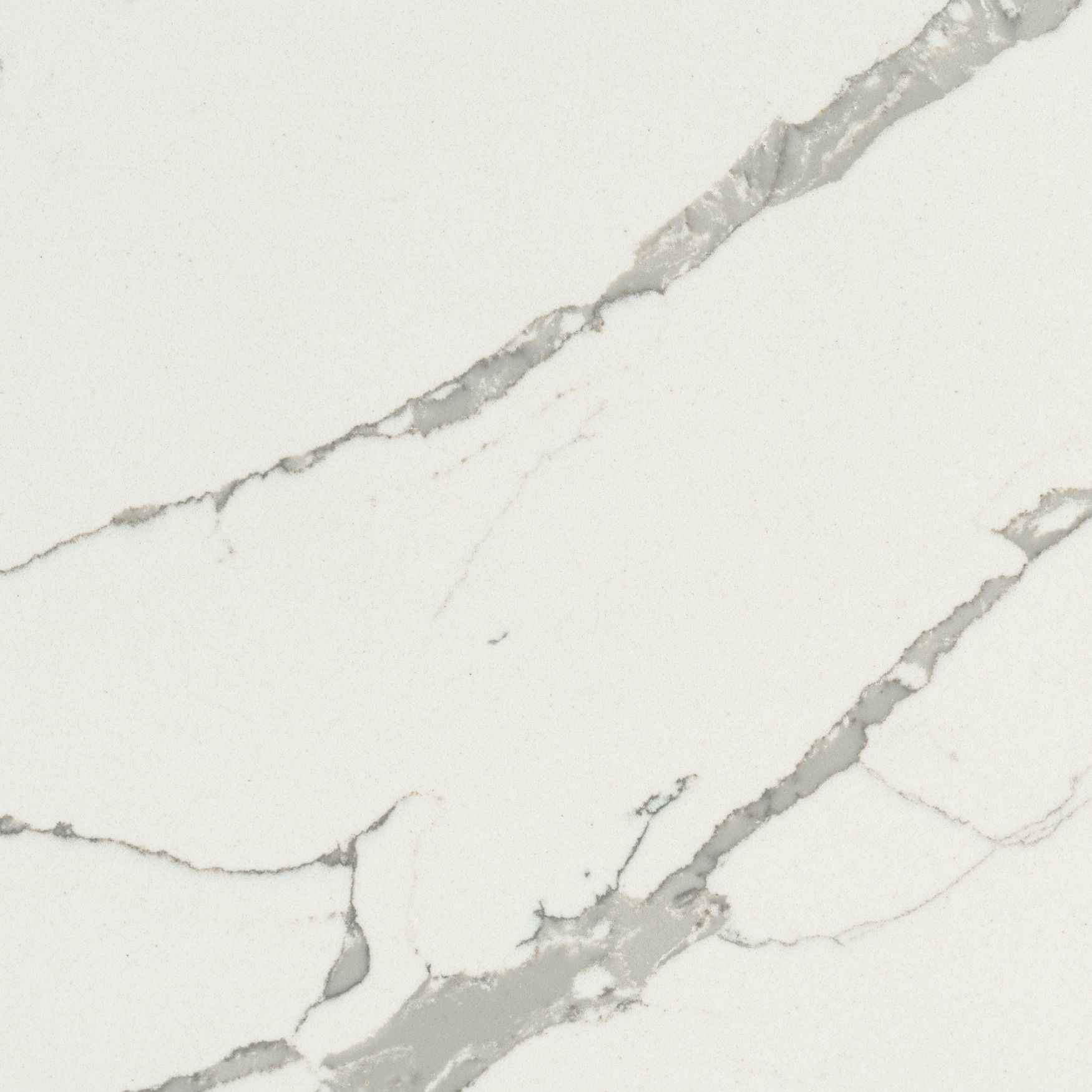 White quartz surface with grey veining.