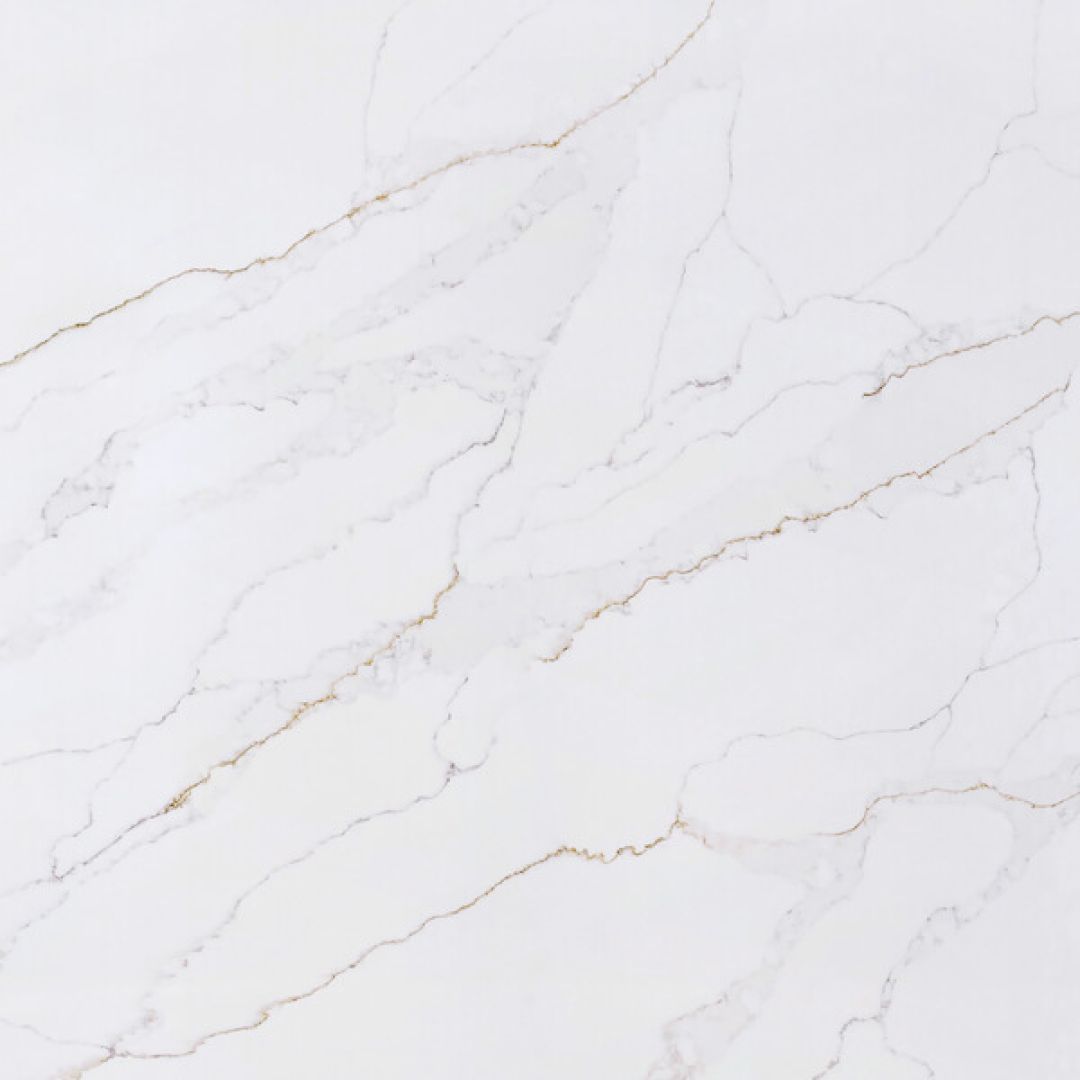 White surface with gold veining, resembling marble or stone.