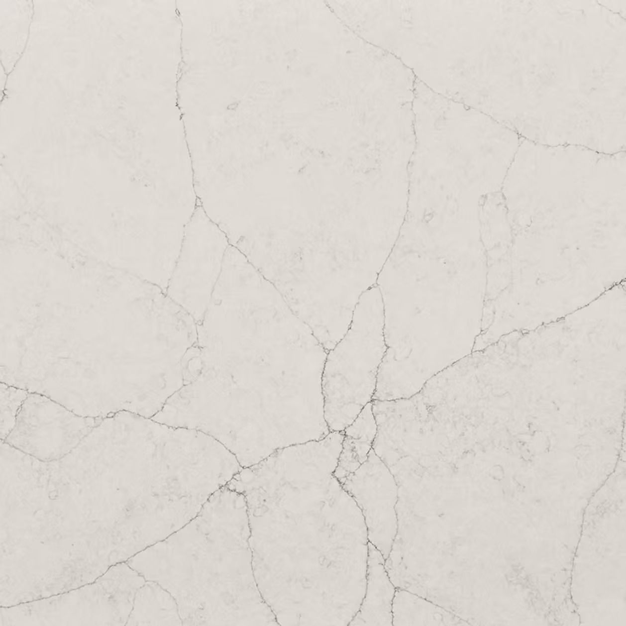 Off-white quartz countertop with veining.