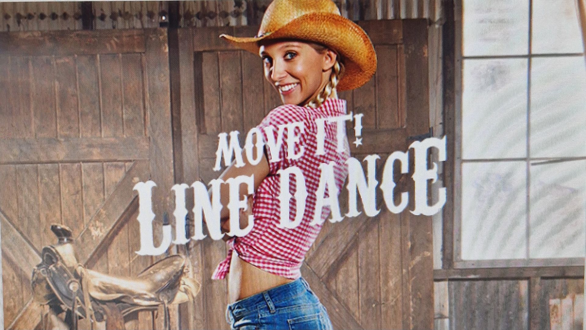 Cowboy-hat dancer in pink shirt and blue jeans with “MOVE IT LINE DANCE” text on a rustic barn backdrop