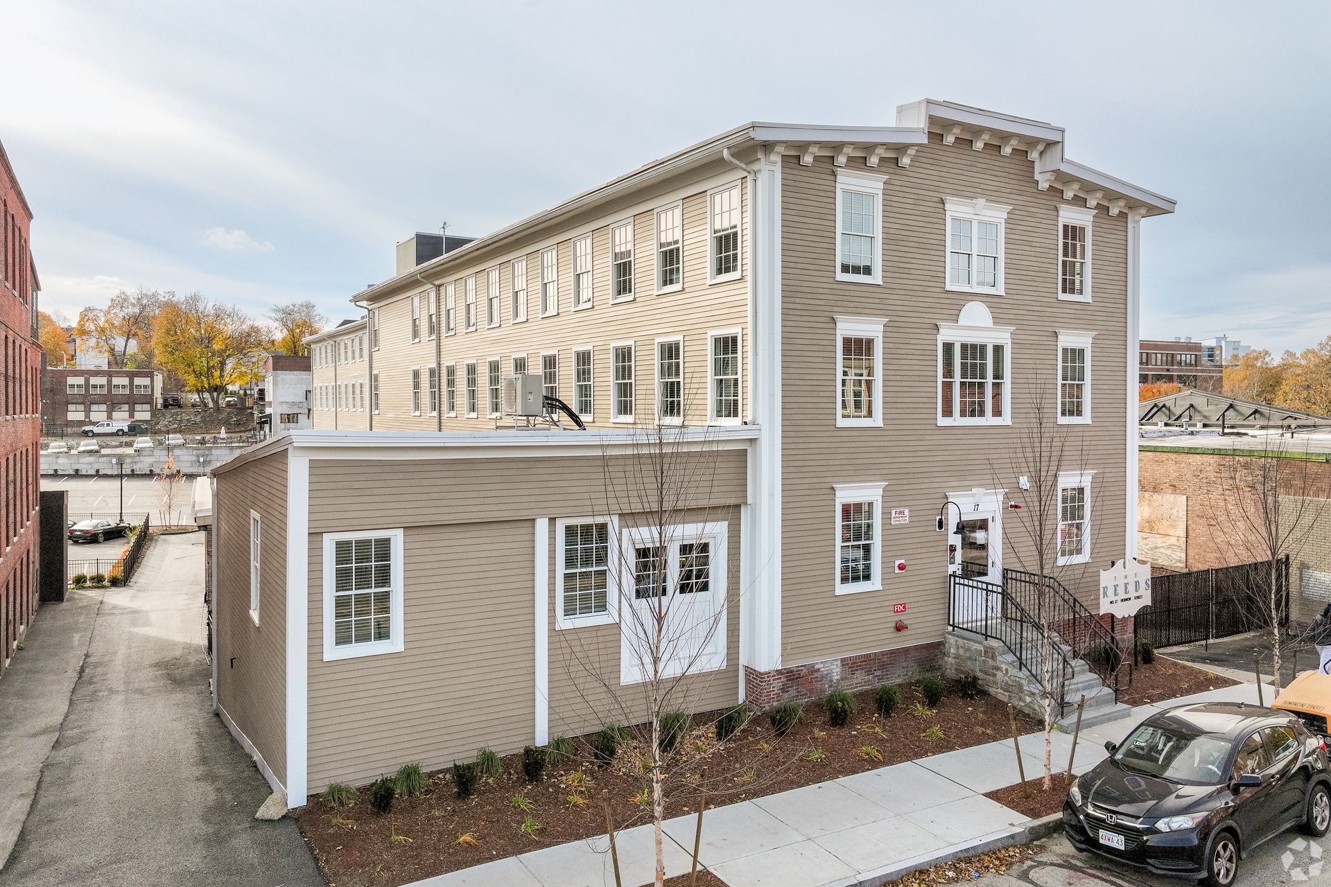 The exterior of The Reeds, a boutique apartment community near WPI in Worcester's Canal District