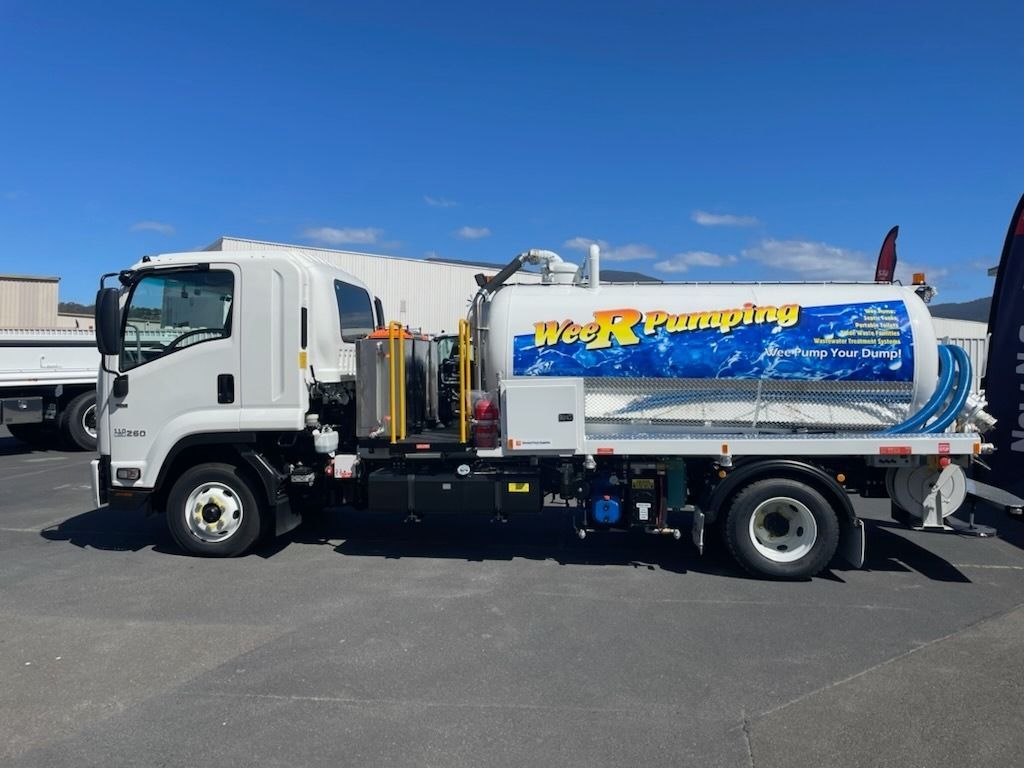 White Vacuum Truck With Blue-and-yellow Logo — Wee R Pumping In Glenorchy, TAS