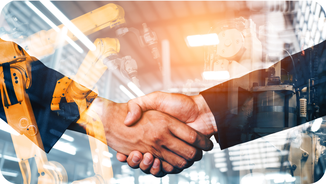 Two people shaking hands; overlaid on a factory with robotic arms. Two people shaking hands; overlaid on a factory with robotic arms.