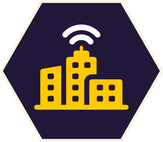 City buildings with wireless signal icon, yellow on dark blue hexagon. City buildings with wireless signal icon, yellow on dark blue hexagon.