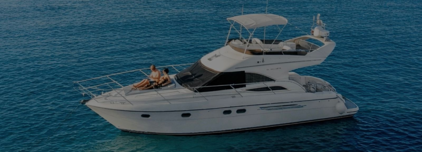 Private yacht charter in Mykonos with guests relaxing on deck
