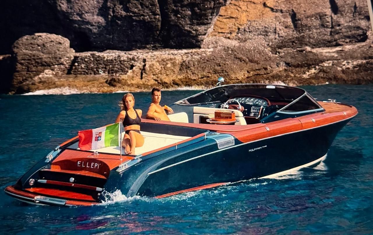 Private speedboat charter in Rhodes, Greece with guests cruising near rocky coastline