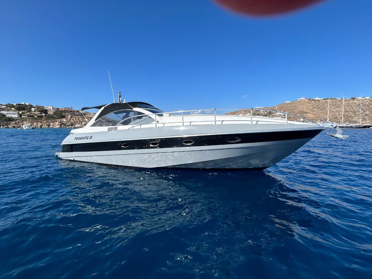 Luxury yacht anchored in blue waters for a private yacht charter in Greece