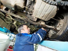 Auto Mechanic at Wheel Alignment Work with Spanner – Auto Repair Shop in Biddeford, ME Auto Mechanic at Wheel Alignment Work with Spanner – Auto Repair Shop in Biddeford, ME