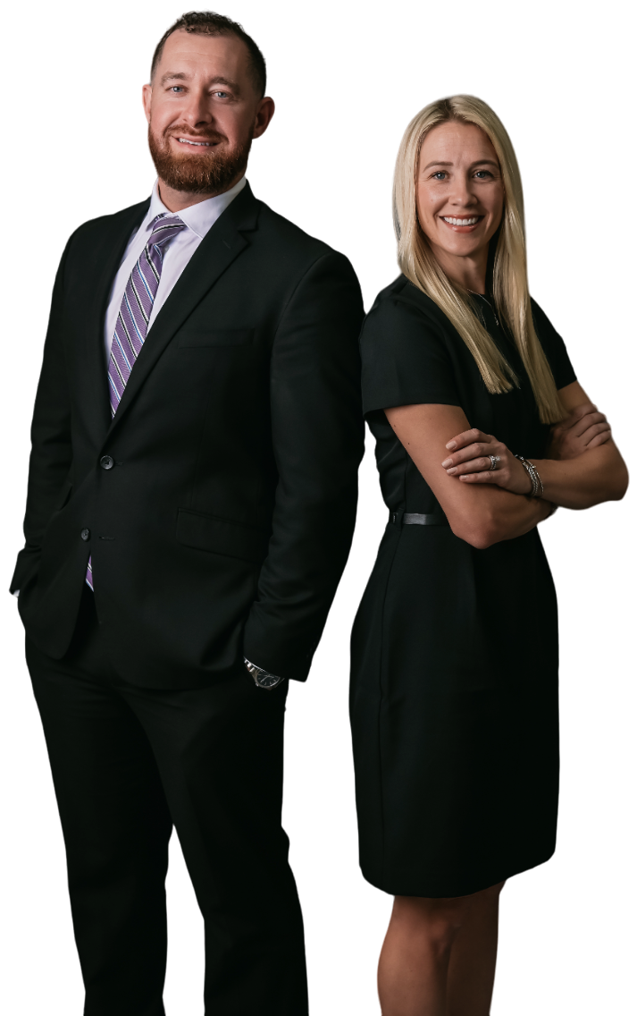 A man and a woman are standing next to each other with their arms crossed.