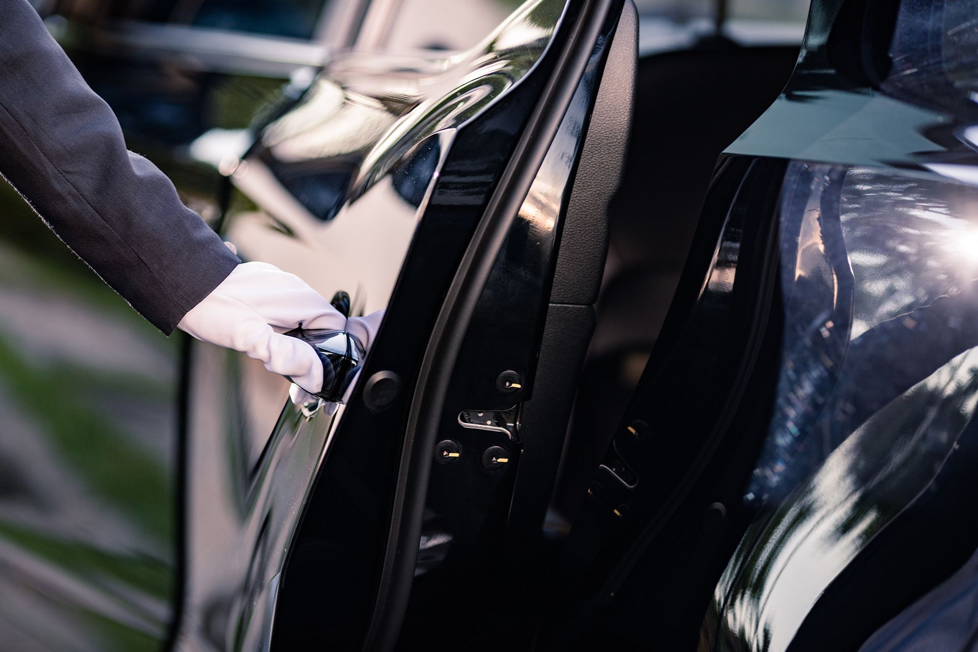 Chauffeur Opening Car Door With Glove
