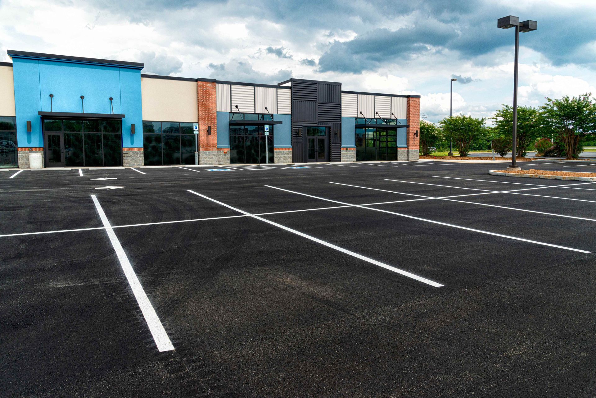 an empty parking lot in front of a building