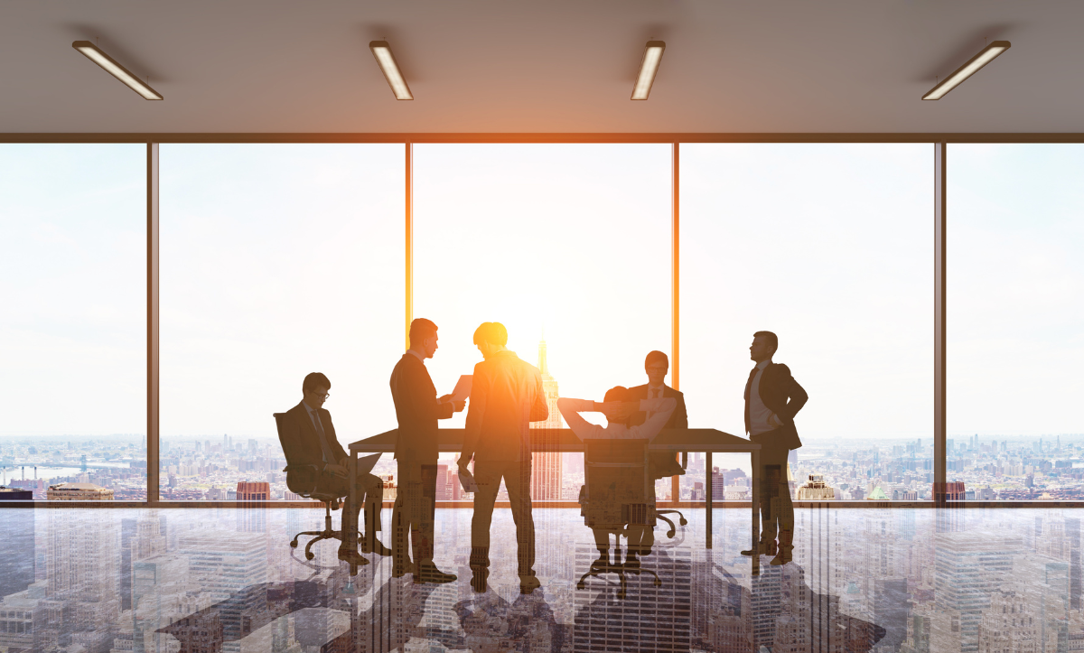 A group of business people are having a meeting in a conference room.