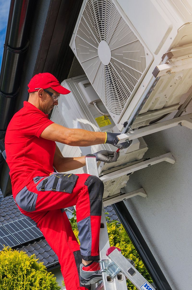 Man Checking The Heat Pump