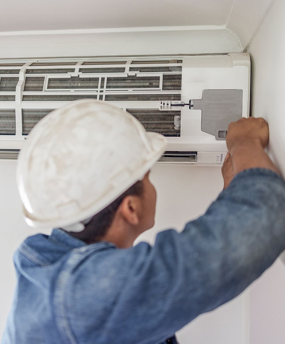 Expert Doing HVAC Maintenance