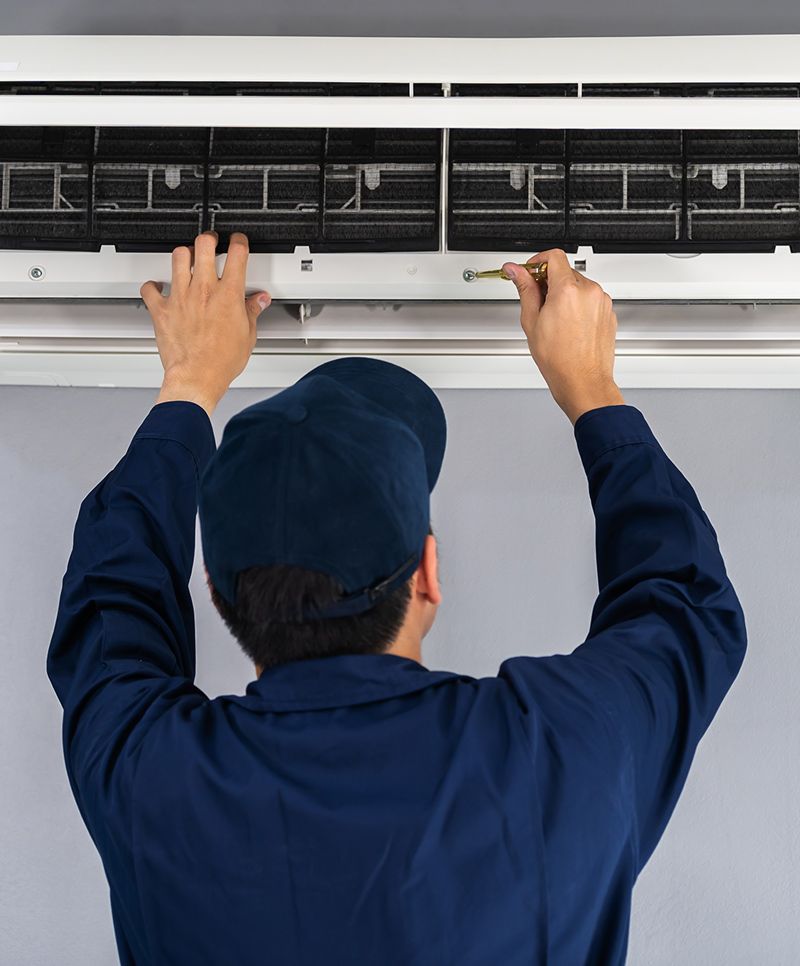 Man Fixing Air Conditioner
