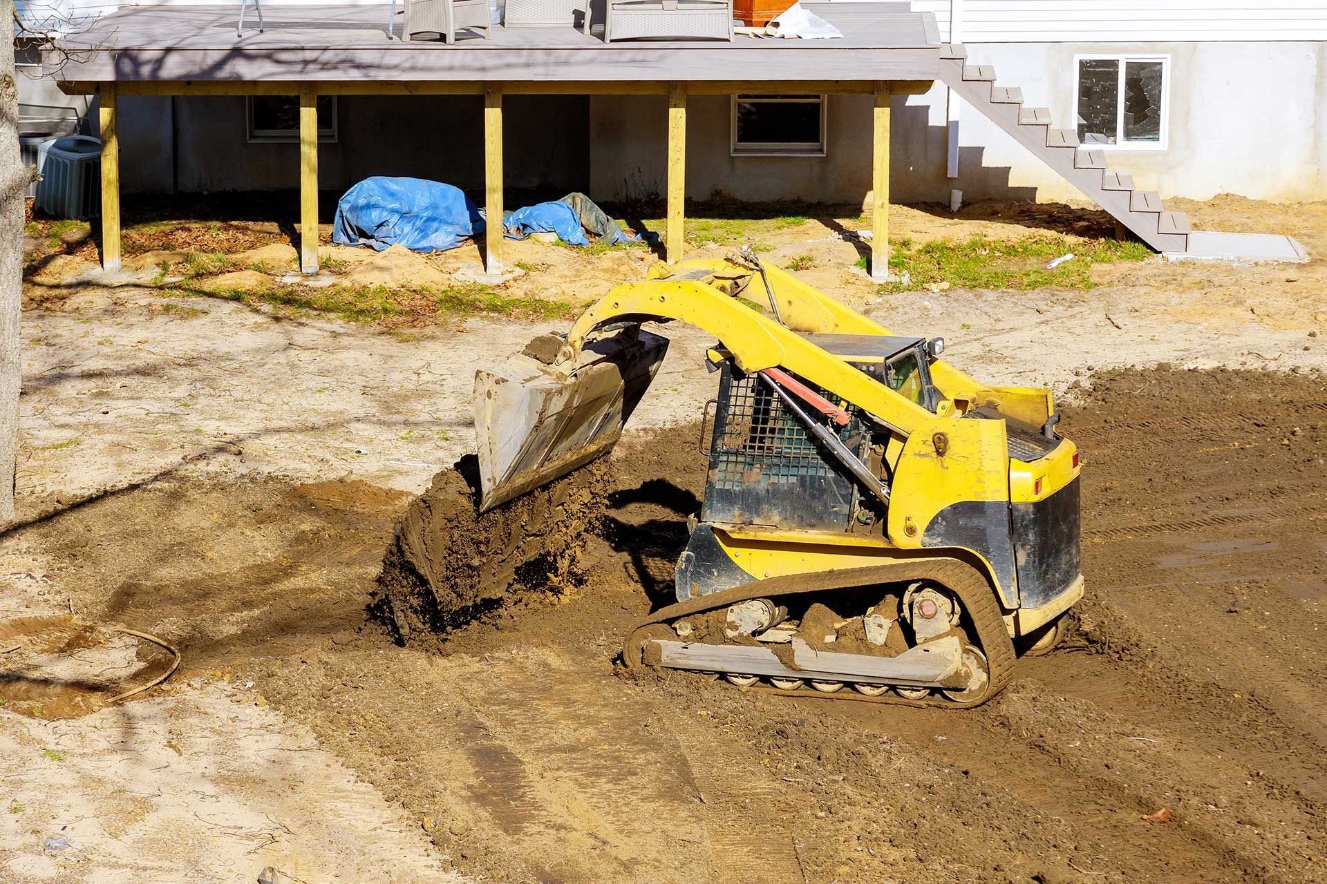 Small tractor digging land working with land 
