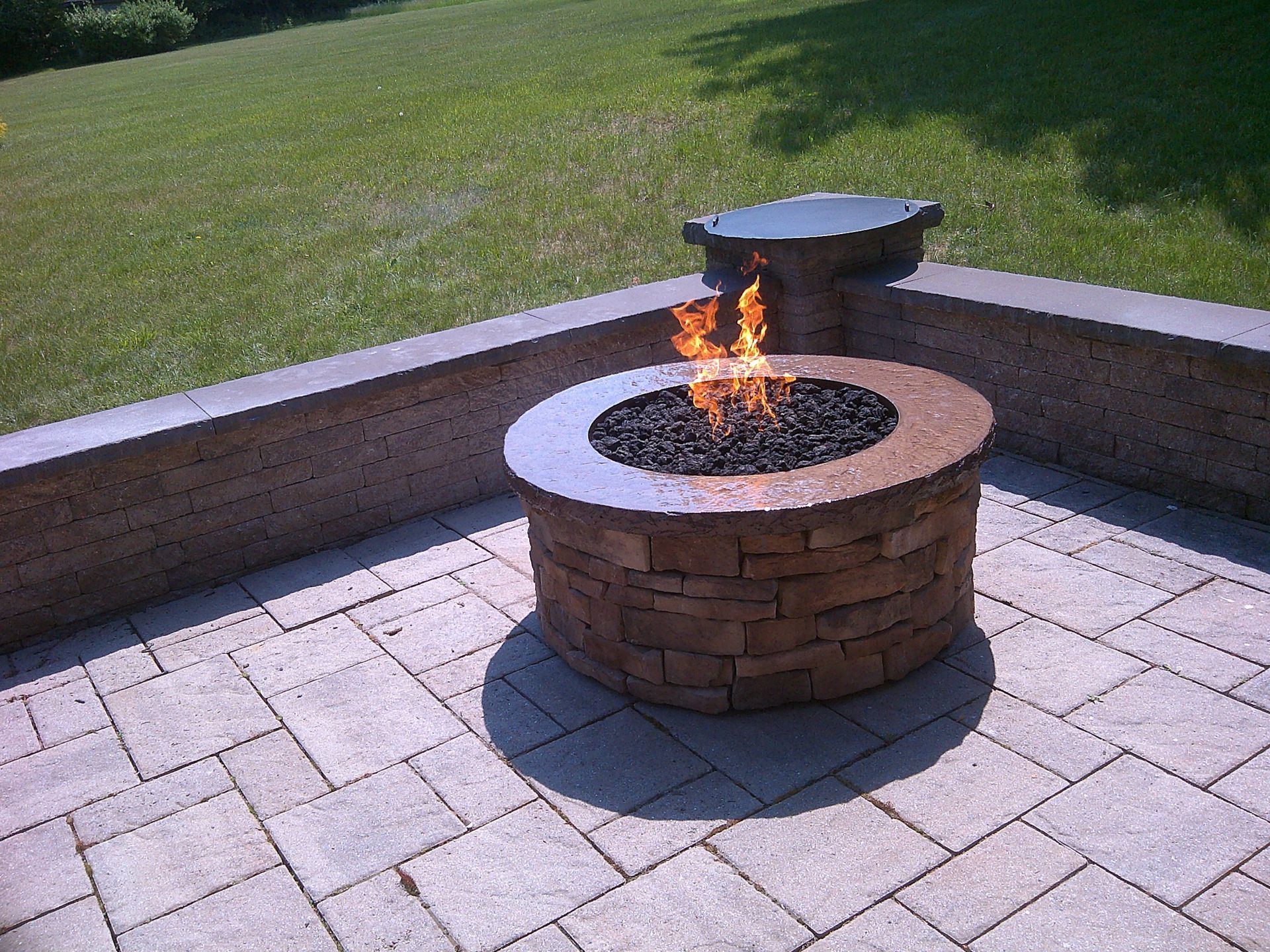 A fire pit with flames coming out of it