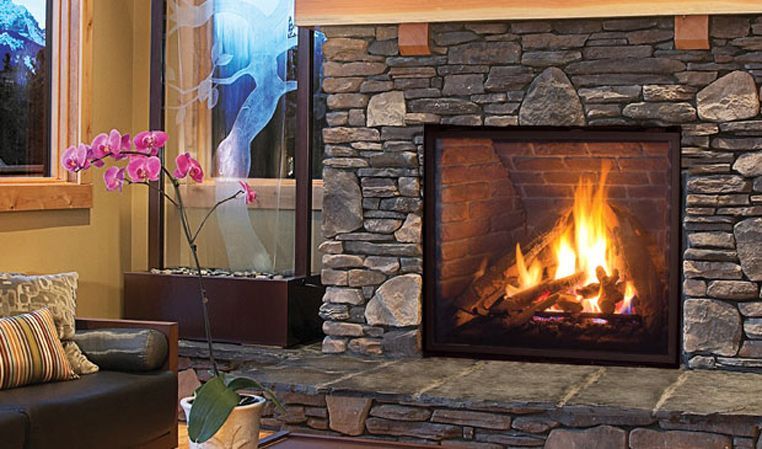 A living room with a fireplace and a couch.