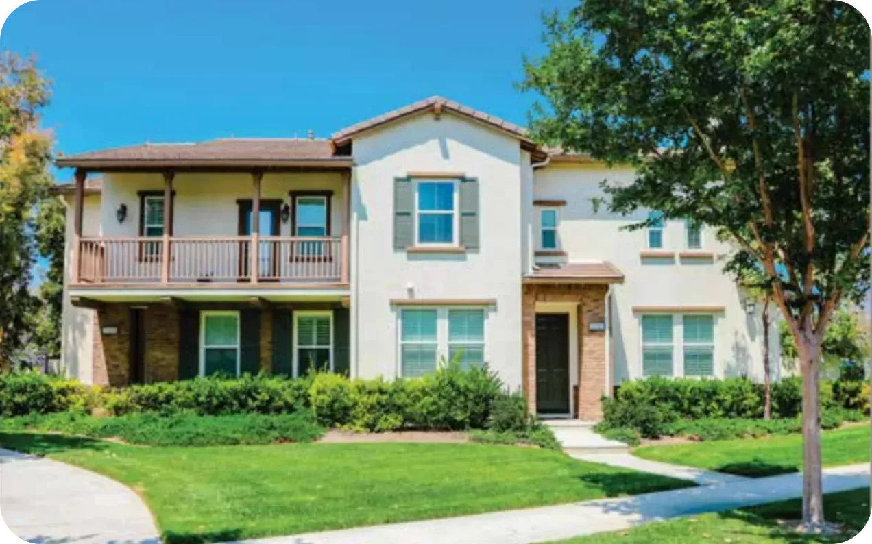 Two-story HOA townhomes with balconies and front lawn