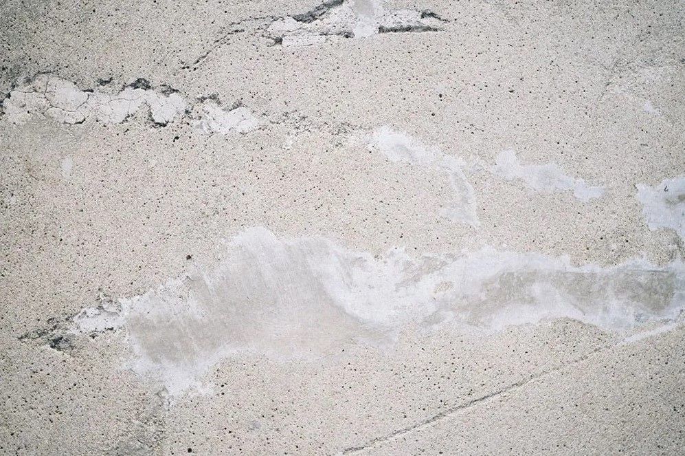 Cracked and spalling concrete surface